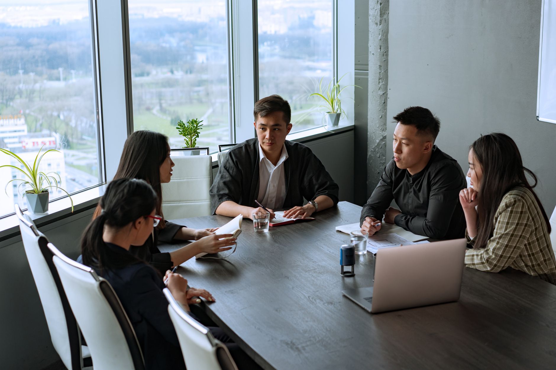Consultants and clients in a working session at a Kuala Lumpur office
